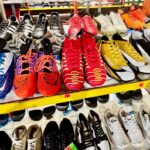 2 athletic footwear, including various styles of molded and studded soccer cleats and casual sneakers