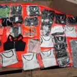 2.2 assortment of packaged athletic tank tops and crop tops