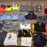 2.2 large assortment of folded promotional and corporate golf shirts and polo shirts in various colors and styles